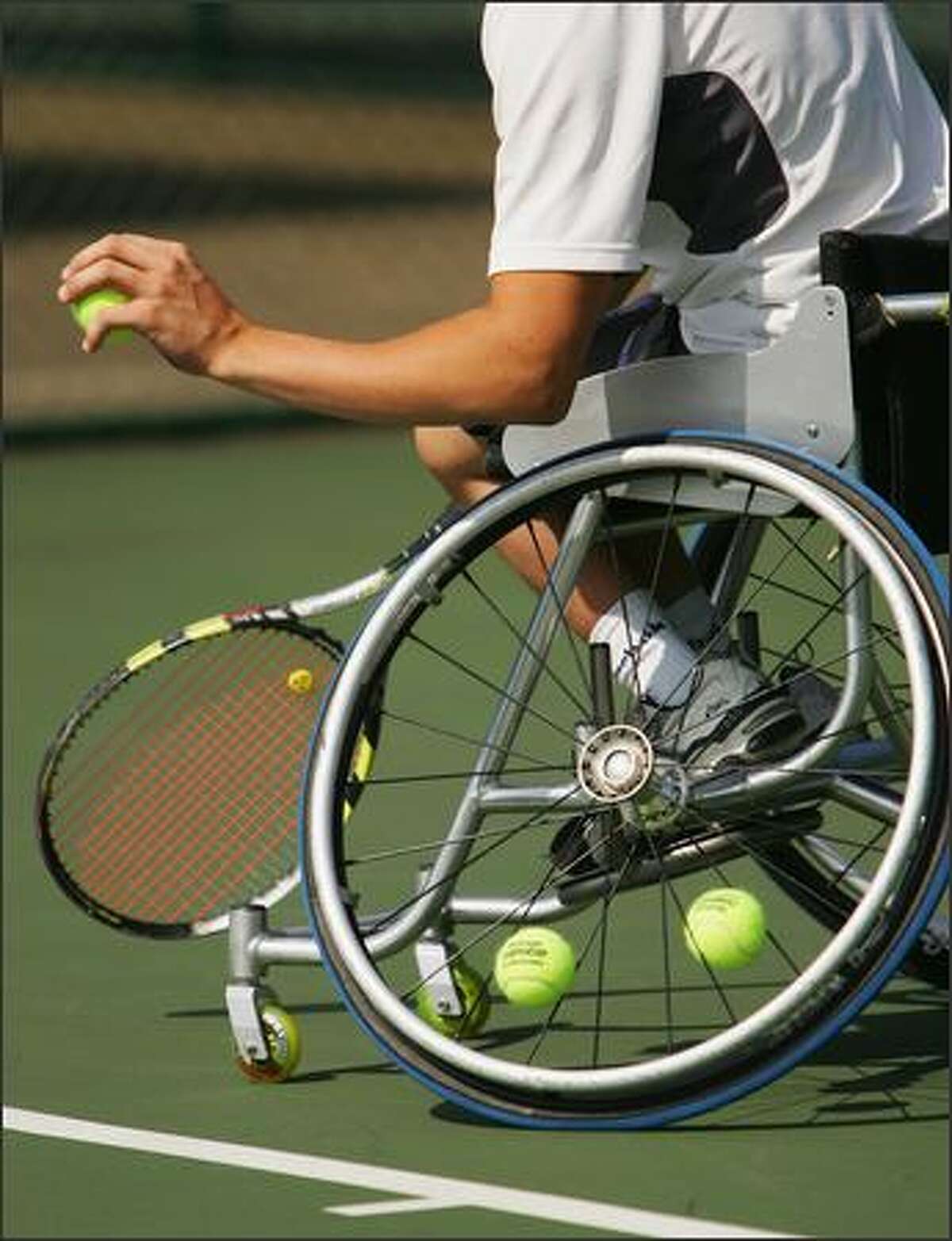 A player serves during the British Open Wheelchair Championships at the Nottingham Tennis Centre on July 24, 2007 in Nottingham, England. Photo by Matthew Lewis/Getty Images