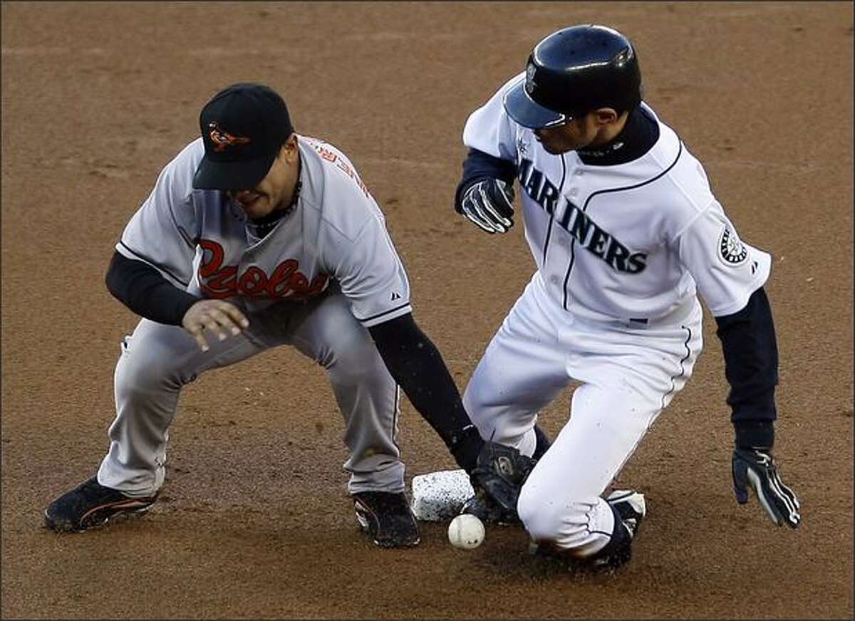 Seattle Mariners Ichiro Suzuki is safe at second on a steal as Baltimore Orioles Luis Hernandez drops the ball during first inning action at Safeco Field.
