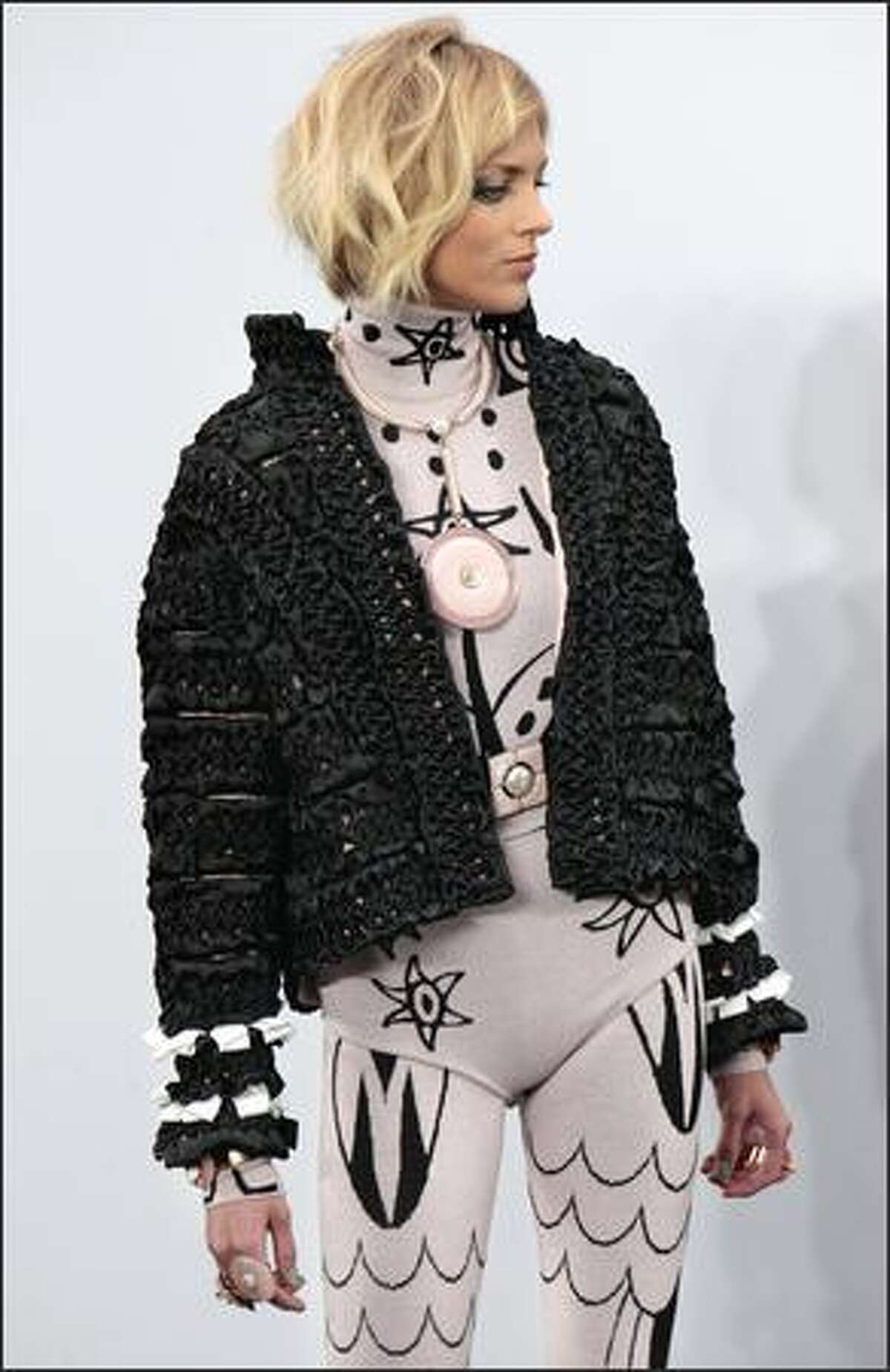 A model presents a creation by German designer Karl Lagerfeld for Chanel during the autumn/winter 2009 ready-to-wear collection show in Paris on Tuesday.