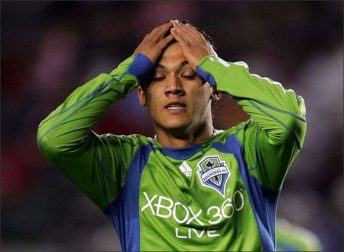 Fredy Montero of Seattle Sounders FC reacts after missing a scoring attempt early in the first half.