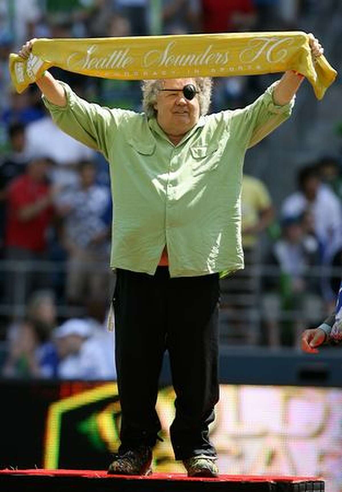 Seattle glass artist Dale Chihuly, pictured receiving a scarf prior to the friendly match between Chelsea FC and Seattle Sounders FC on July 18, 2009.