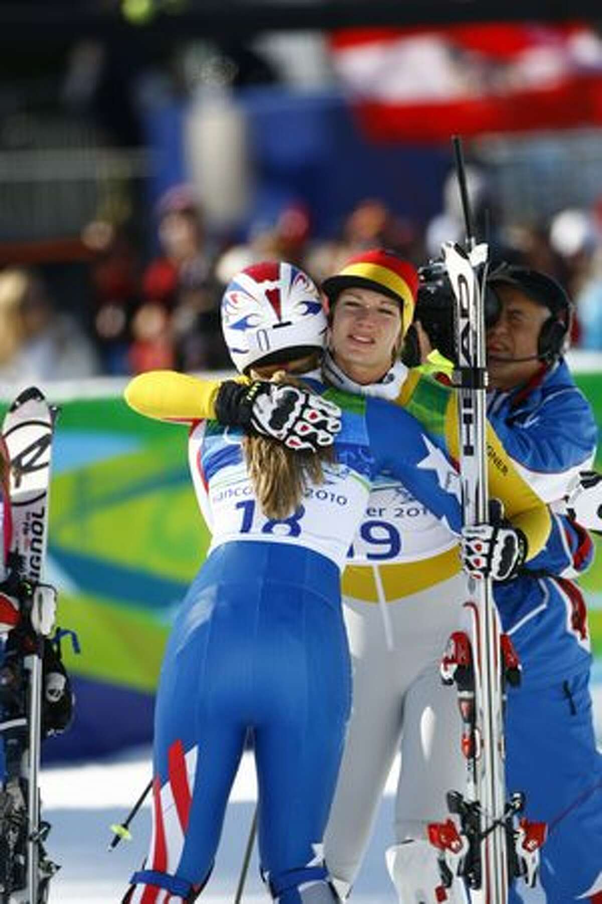Following a crash during her slalom run, Lindsey Vonn graciously congratulates gold-medal winner Maria Riesch of German. After setting the pace for the field with her downhill run earlier in the day, Lindsey Vonn crashed within sight of the finish line during the slalom portion of the womens super combined event to ruin her chances at medals in back-to-back events at Whistler Creekside at the 2010 Winter Olympic Games on Thursday, Feb. 18, 2010, in Vancouver. ( Jay Hu / For the Houston Chronicle during the slalom portion of the womens super combined event at Whistler Creekside at the 2010 Winter Olympic Games on Thursday, Feb. 18, 2010, in Vancouver. ( Jay Hu / For the Houston Chronicle ).