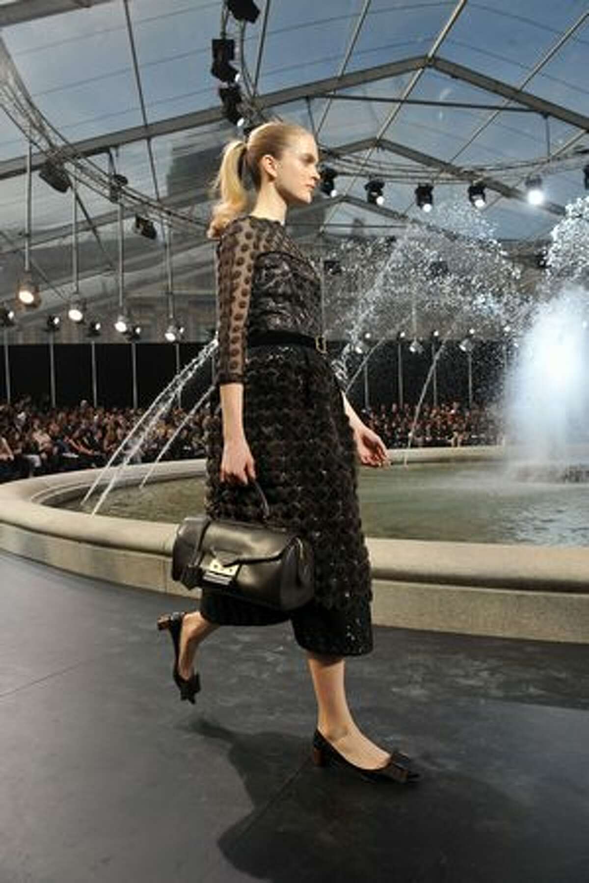 A model walks the runway during the Vuitton Ready to Wear Fall