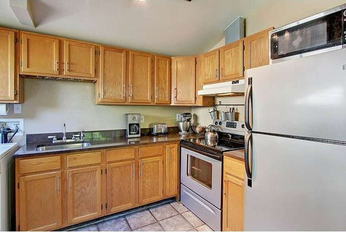 The kitchen has granite counters and new appliances. (Windermere.com) See the listing.