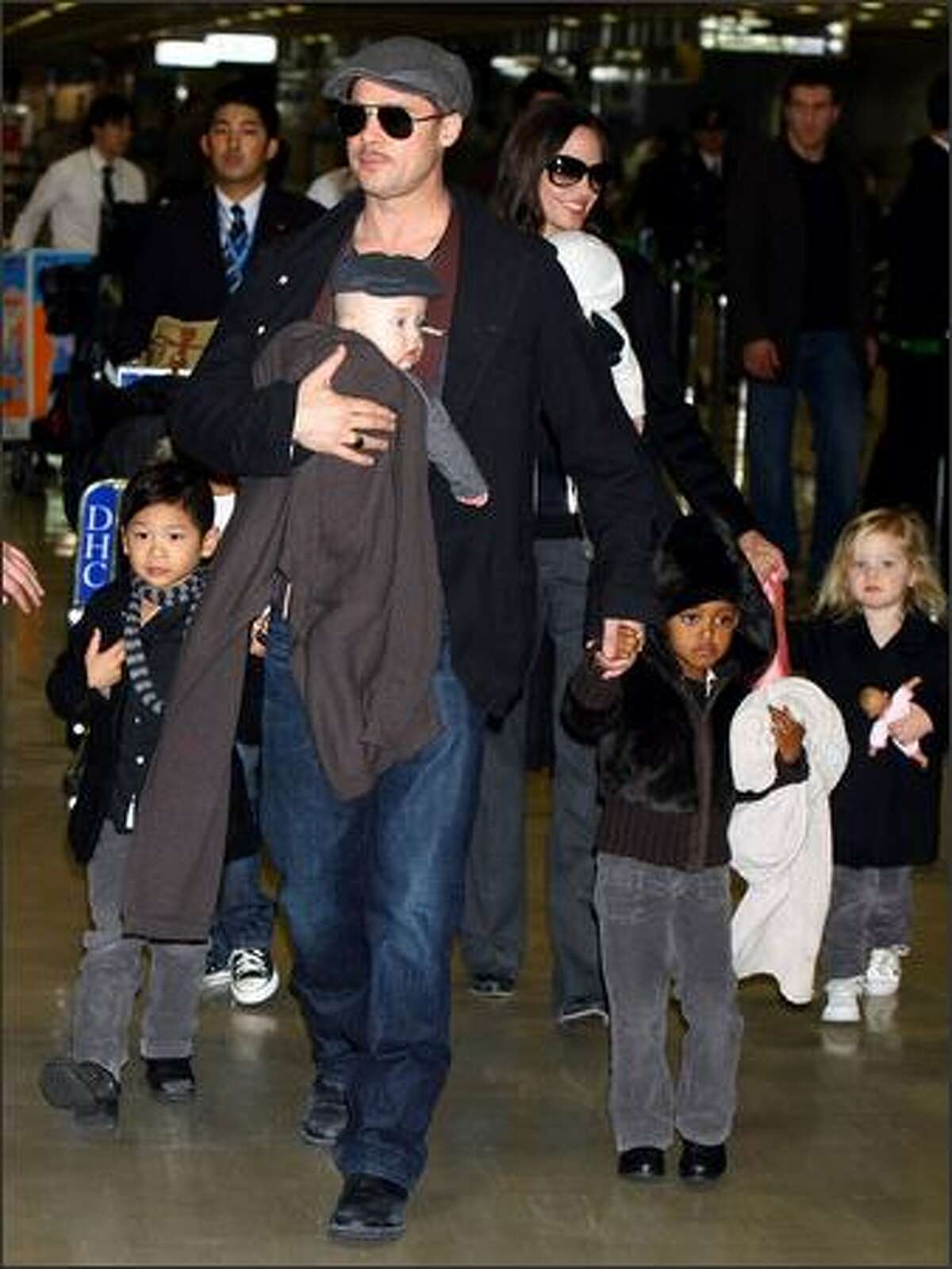 Actor Brad Pitt and Angelina Jolie arrive at Narita International Airport with their children (L to R) Pax Thien, Knox, Zahara and Shiloh in Narita, Chiba, Japan. Brad is visiting Japan to promote his film "The Curious Case Of Benjamin Button".