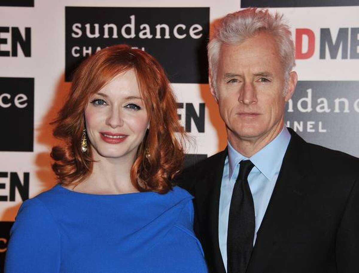 PARIS, FRANCE - (L-R) Actors Christina Hendricks and John Slattery attend the AMC - Mad Men Gala Event at Hotel Royal Monceau Raffle on Tuesday in Paris, France.