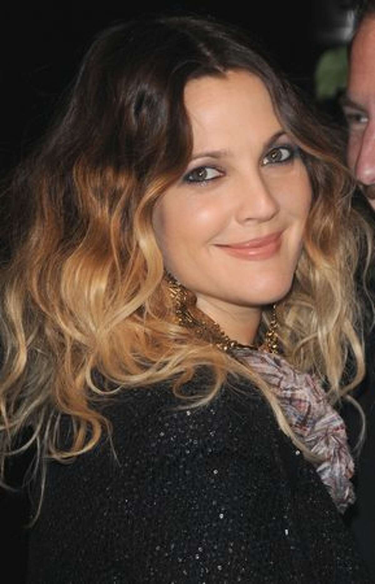 Actress Drew Barrymore arrives at the Chanel & Charles Finch Pre-Oscar Dinner Celebrating Fashion & Film at Madeo Restaurant in Los Angeles, California.