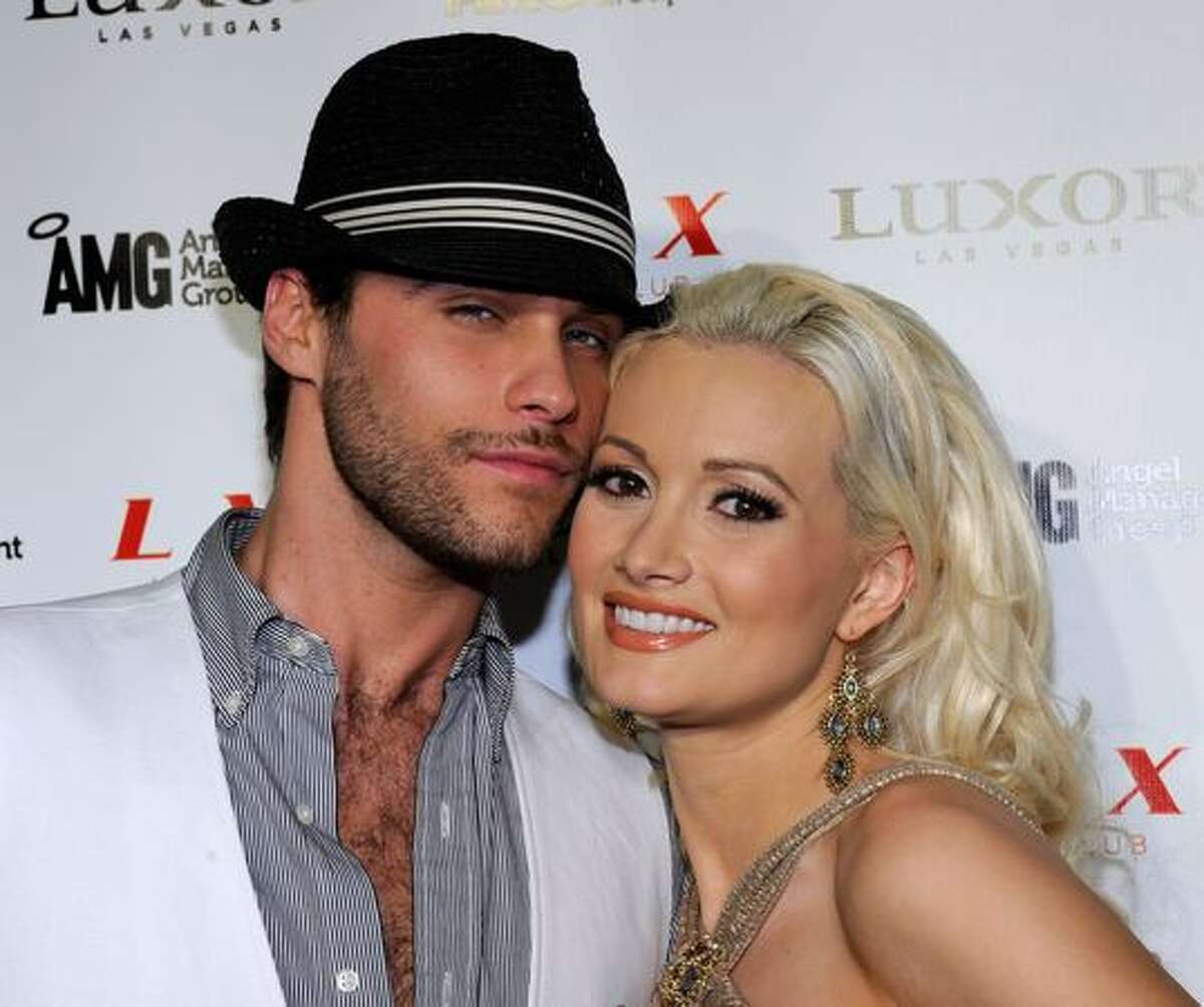 Co-stars from the production show "PEEPSHOW" and the television show "Holly's World" Josh Strickland (L) and Holly Madison arrive at the LAX Nightclub at the Luxor Resort & Casino for the debut performance of Strickland's single, "Report to the Floor" in Las Vegas, Nevada.