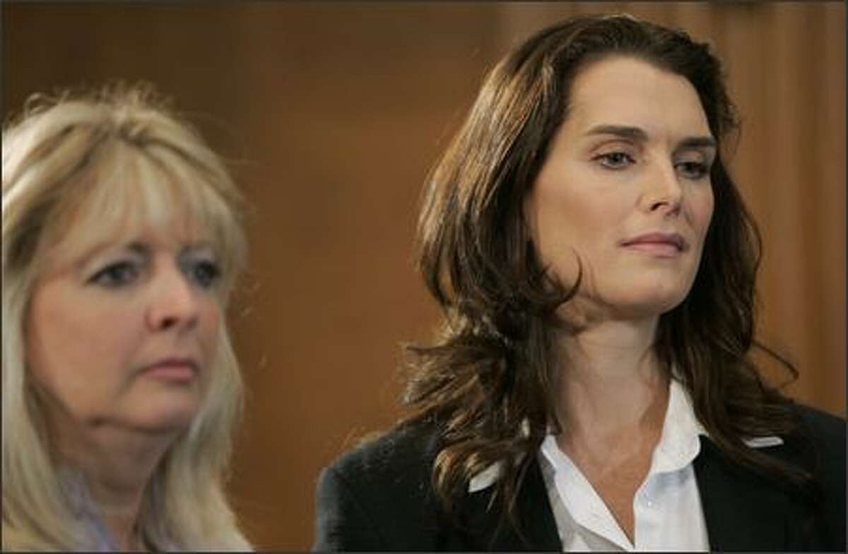 Actress Brooke Shields, right, and Mary Jo Codey, a longtime postpartum depression advocate, and wife of former New Jersey Gov. Richard Codey, left, listen during a news conference on Capitol Hill in Washington, Friday, to support legislation for federal investment in postpartum depression education, detection and treatment. (AP Photo/Susan Walsh)