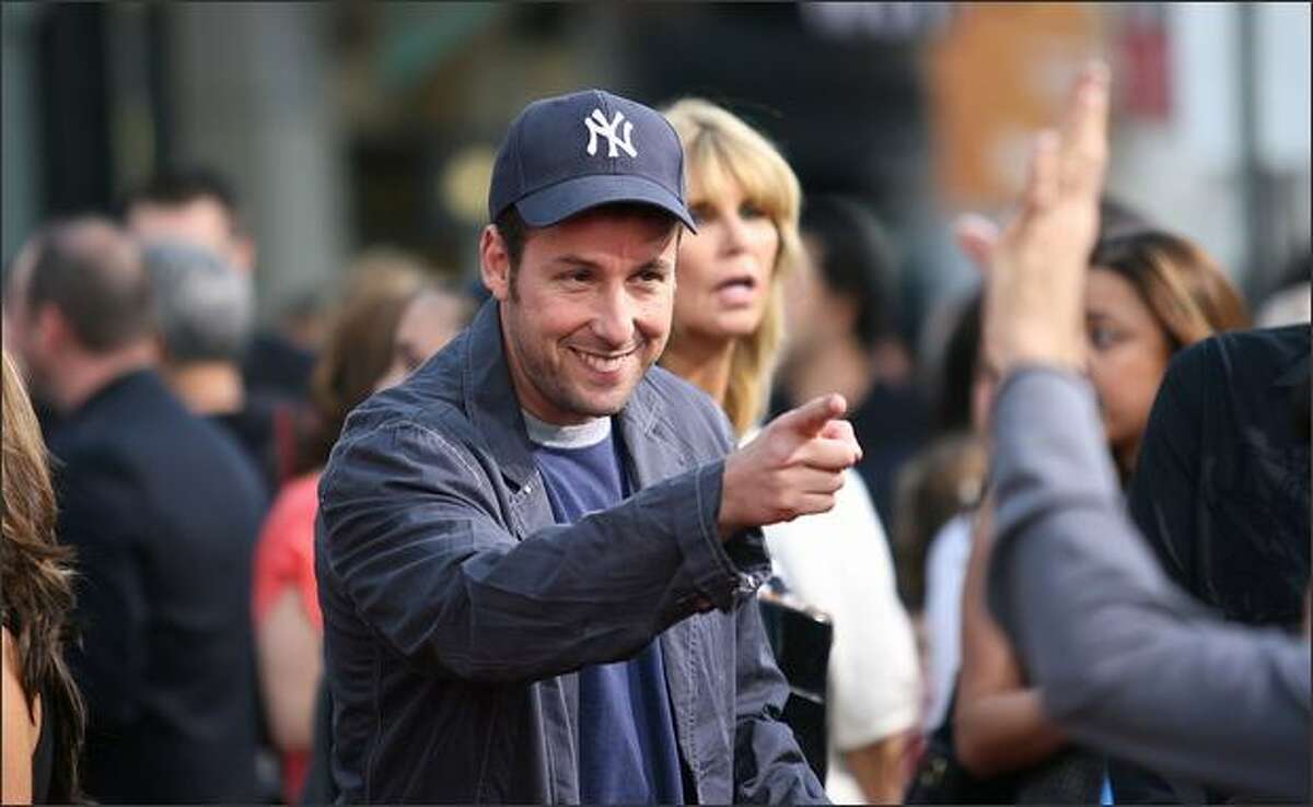 Actor Adam Sandler speaks to a fan during the "You Don't Mess With The Zohan" film premiere at Grauman's Chinese Theatre in Hollywood, California.