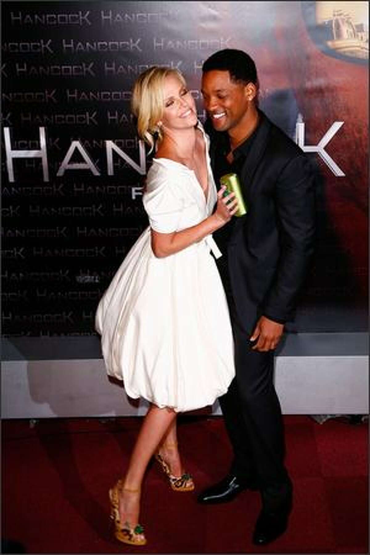 Charlize Theron and Will Smith attend the movie premiere of "Hancock" at L'Olympia Hall in Paris, France.