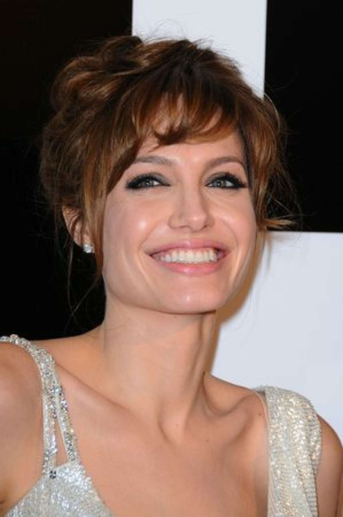 Actress Angelina Jolie poses as she attends the premiere for "Salt" at Le Grand Rex in Paris, France.