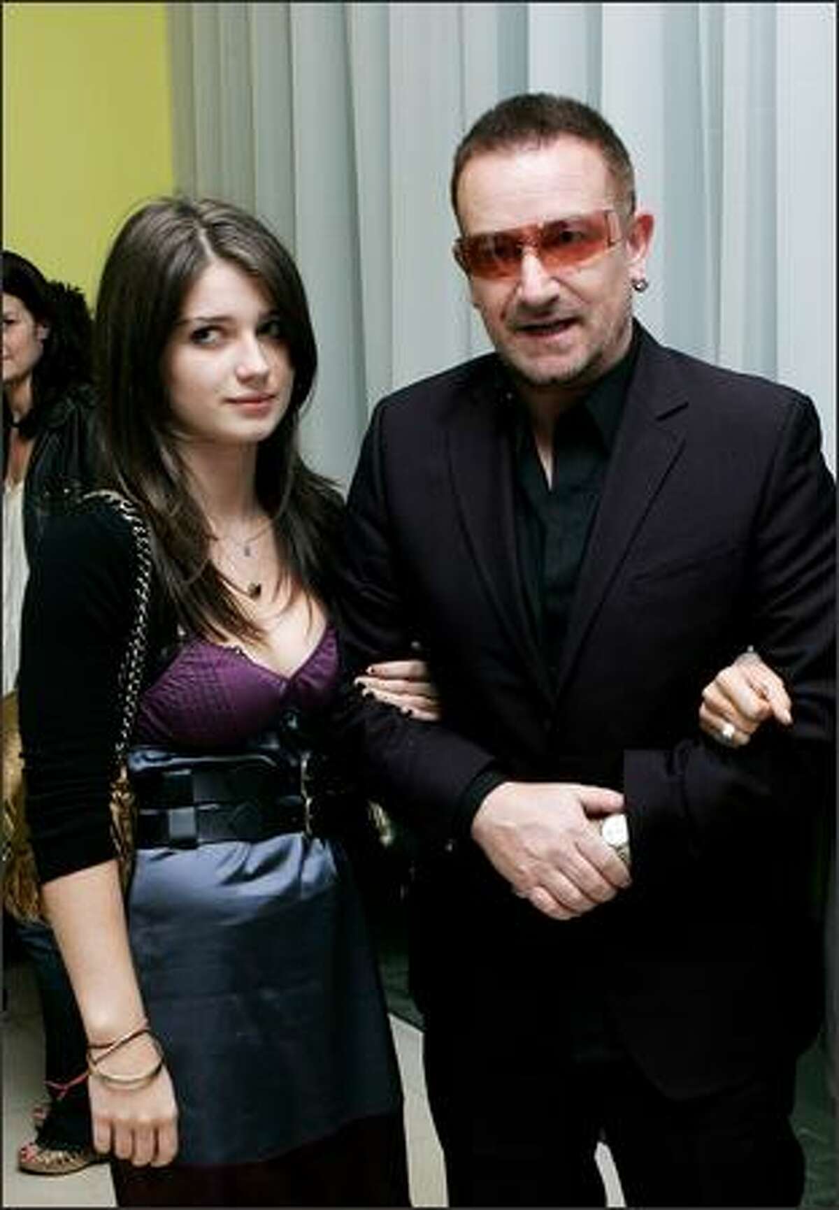 U2 frontman Bono and his guest arrive at the afterparty following "Across The Universe" at Bungalow 8, St Martin's Lane Hotel, on September 26, 2007 in London, England.