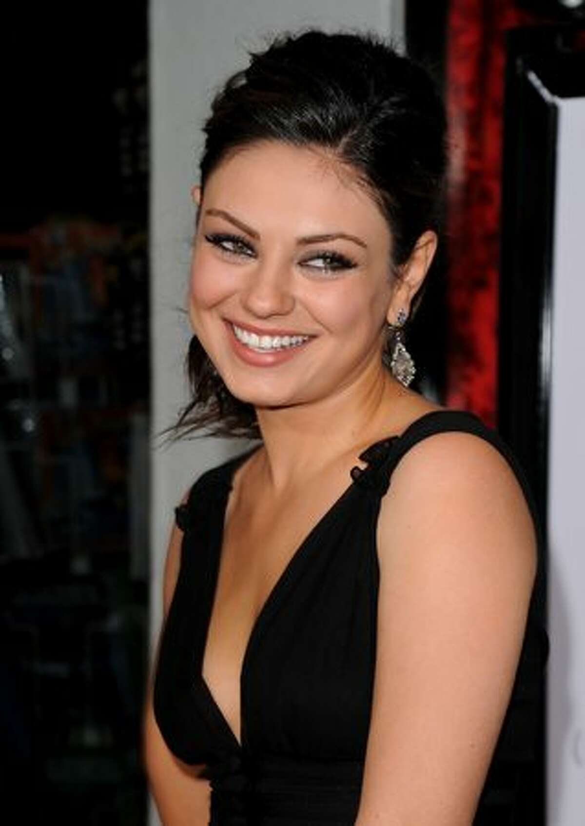Actress Mila Kunis arrives at the "Black Swan" closing night gala during AFI FEST 2010 presented by Audi held at Grauman's Chinese Theatre in Hollywood, California.