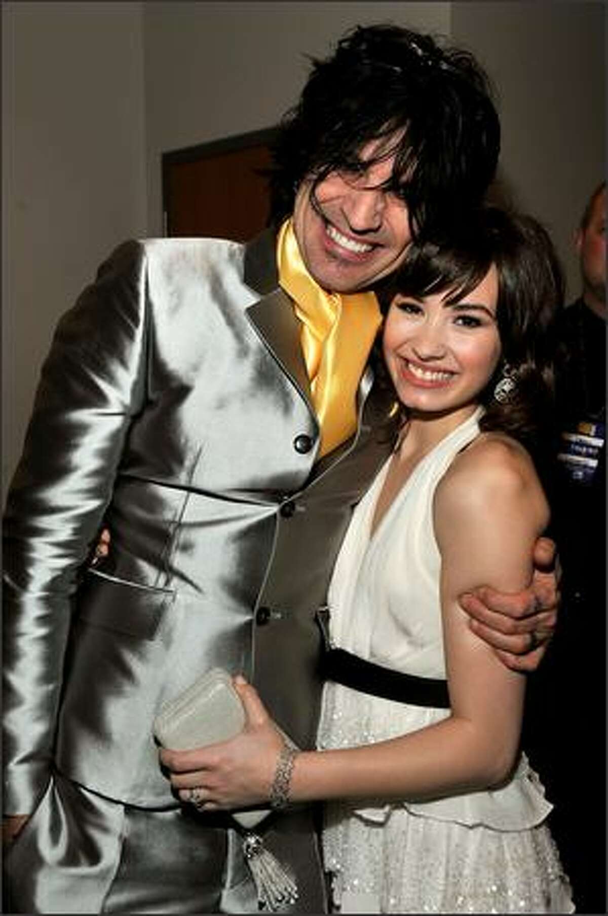 Musician Tommy Lee and actress/singer Demi Lovato pose backstage at the 2008 American Music Awards held at Nokia Theatre L.A. LIVE in Los Angeles, California.