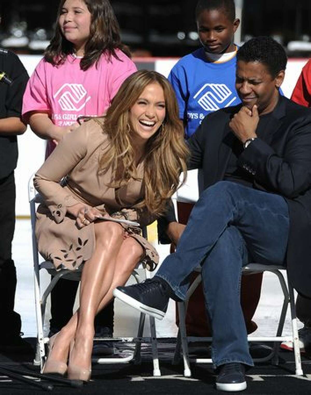 Actress Jennifer Lopez and actor Denzel Washington are photographed as Denzel Washington announces Jennifer Lopez as a national spokesperson for The Boys & Girls Club Of America in Los Angeles, California.