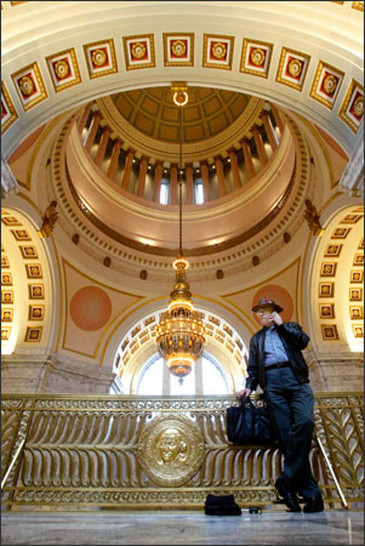 Bob Higley of Olympia, a lobbyist with the Faith and Freedom Network, makes a call Tuesday from the state Capitol in anticipation of the start Monday of the 60-day legislative session.