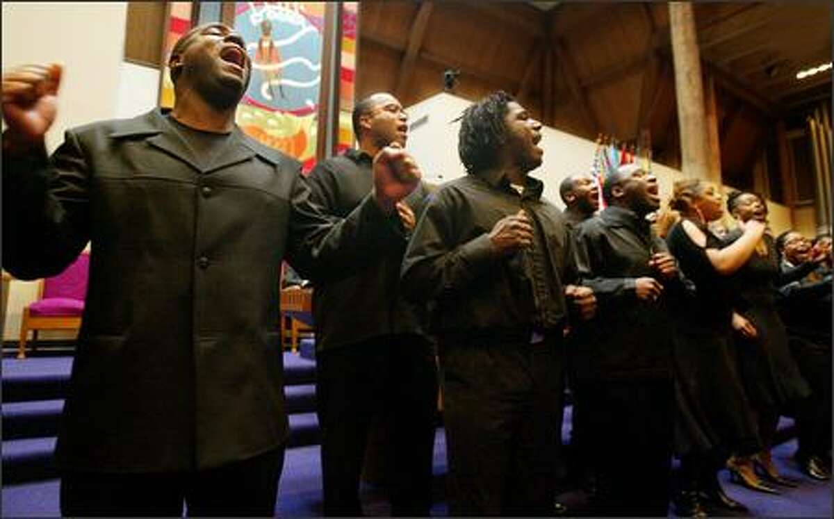 DaNell Daymon and Royalty, a Seattle area gospel choir, opened Seattle Community Colleges's 33rd Annual Martin Luther King, Jr. Community Celebration at Mt. Zion Baptist Church with a rousing performance. From left are Kenneth Mahoney II, Michael Thomas and Jerry Dawson.