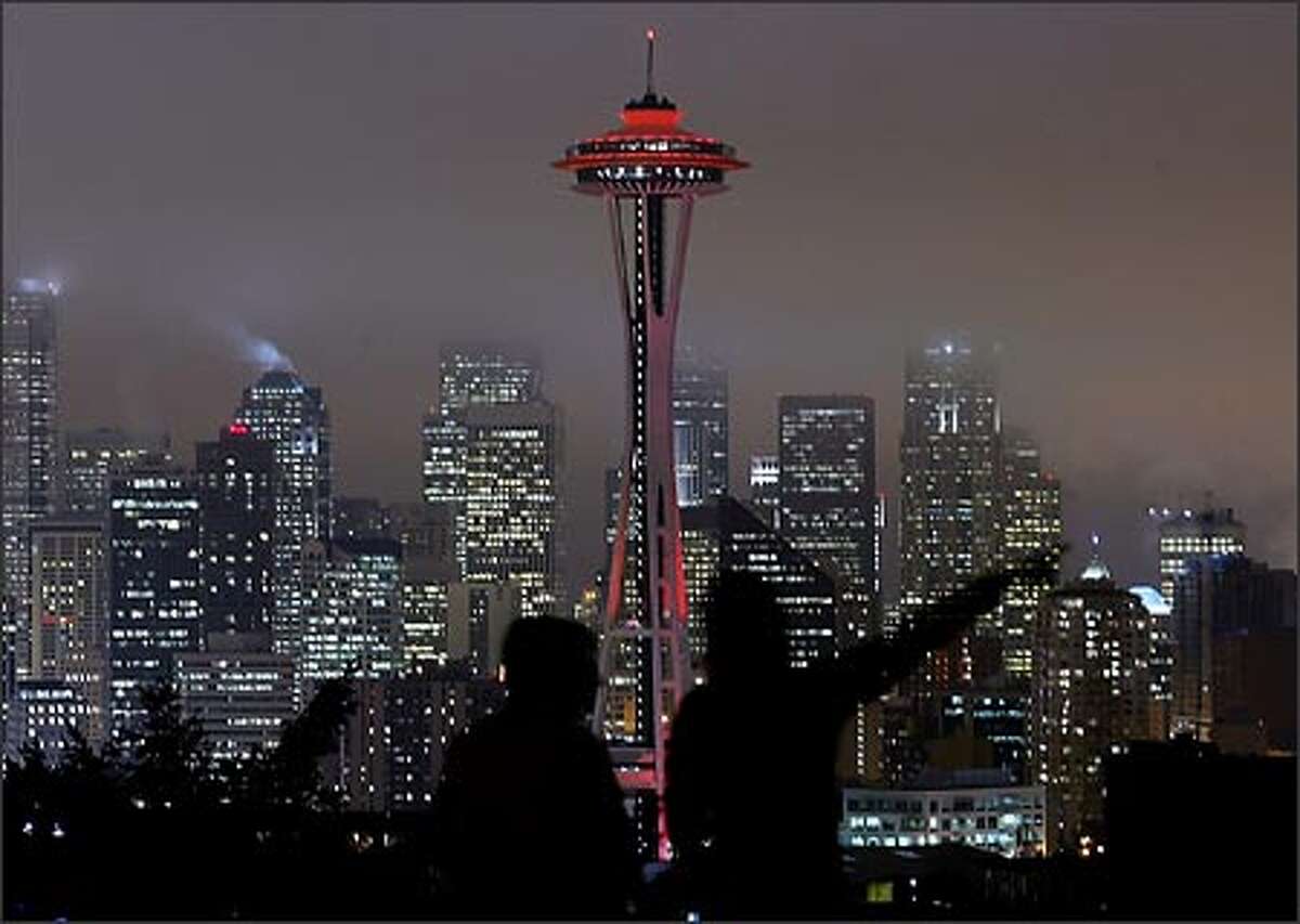 The Space Needle is bathed in red light Thursday night to kick off Friday's National Wear Red for Women Day. The designation is aimed at raising awareness of cardiovascular diseases, the No. 1 killer of women. Among other iconic structures "going red" were the Washington Monument and New York's Empire State Building.