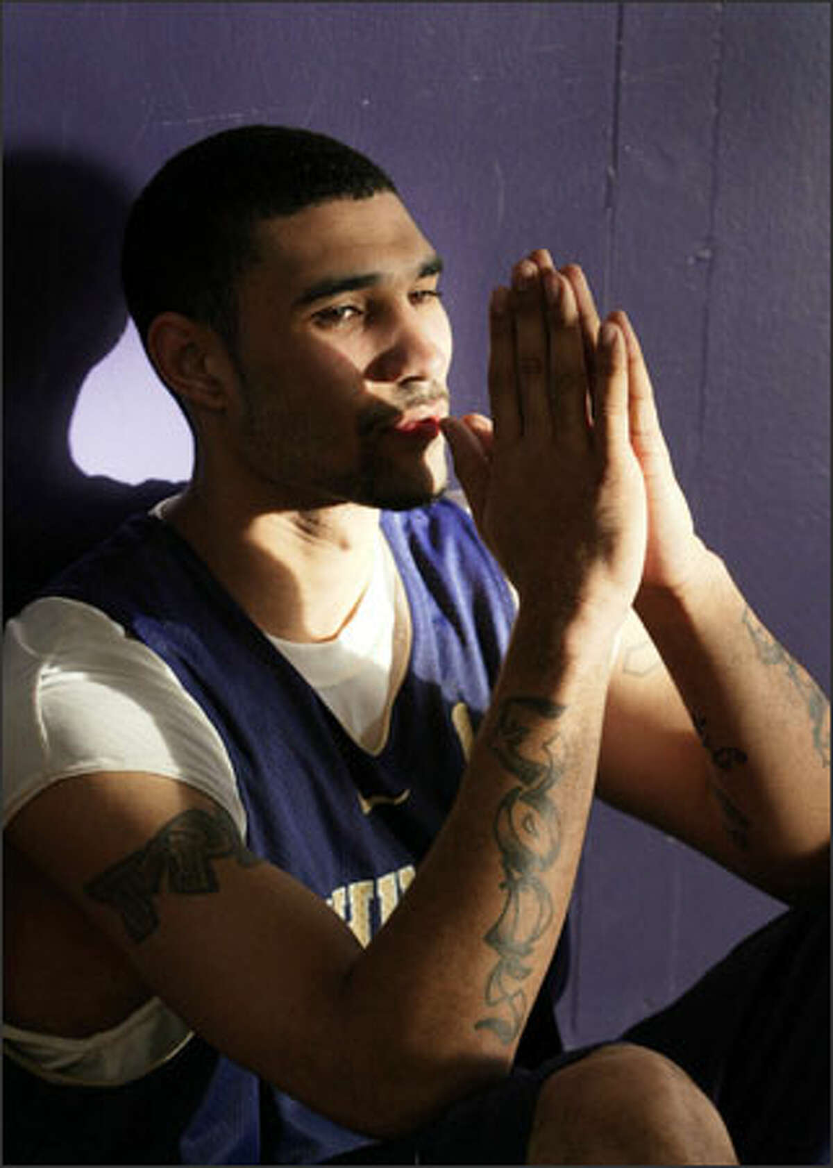 Washington guard Tre Simmons has "God's Gift" tattooed on the outside of his forearms, meaning he is a gift from God.