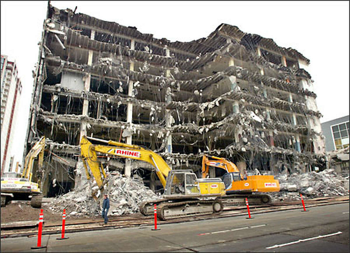 Demolition moves ahead Sunday on the Arcade Building, along Union Street between First and Second avenues in Seattle. The demolition will make room to expand the Seattle Art Museum and for Washington Mutual's new headquarters. The building dates back to the early 1900s. It was the original location of the Rhodes Department Store.
