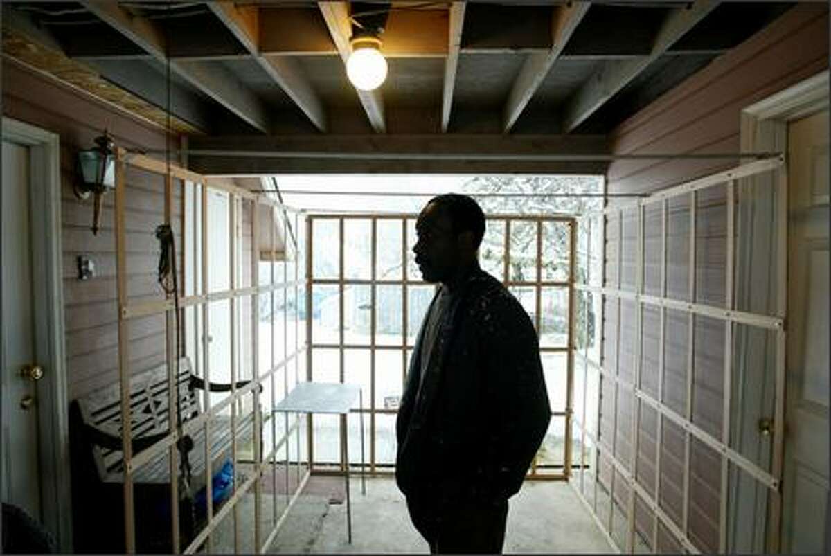 Willie Robinson, who performs a play about his 20 years of incarceration for murder, is shown Wednesday at his Lake Stevens home in the "cell" he built as the set for the play. It was written by Lea Zengage, a founder of the inmate advocacy group Justice Works!