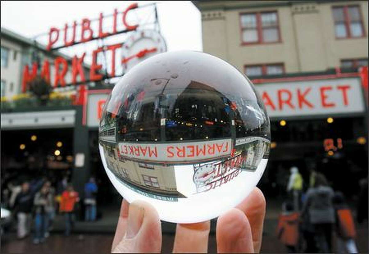 You can buy almost anything, including carrots, kites and crystal balls, at Pike Place Market in Seattle. The Market celebrates its centennial starting today.