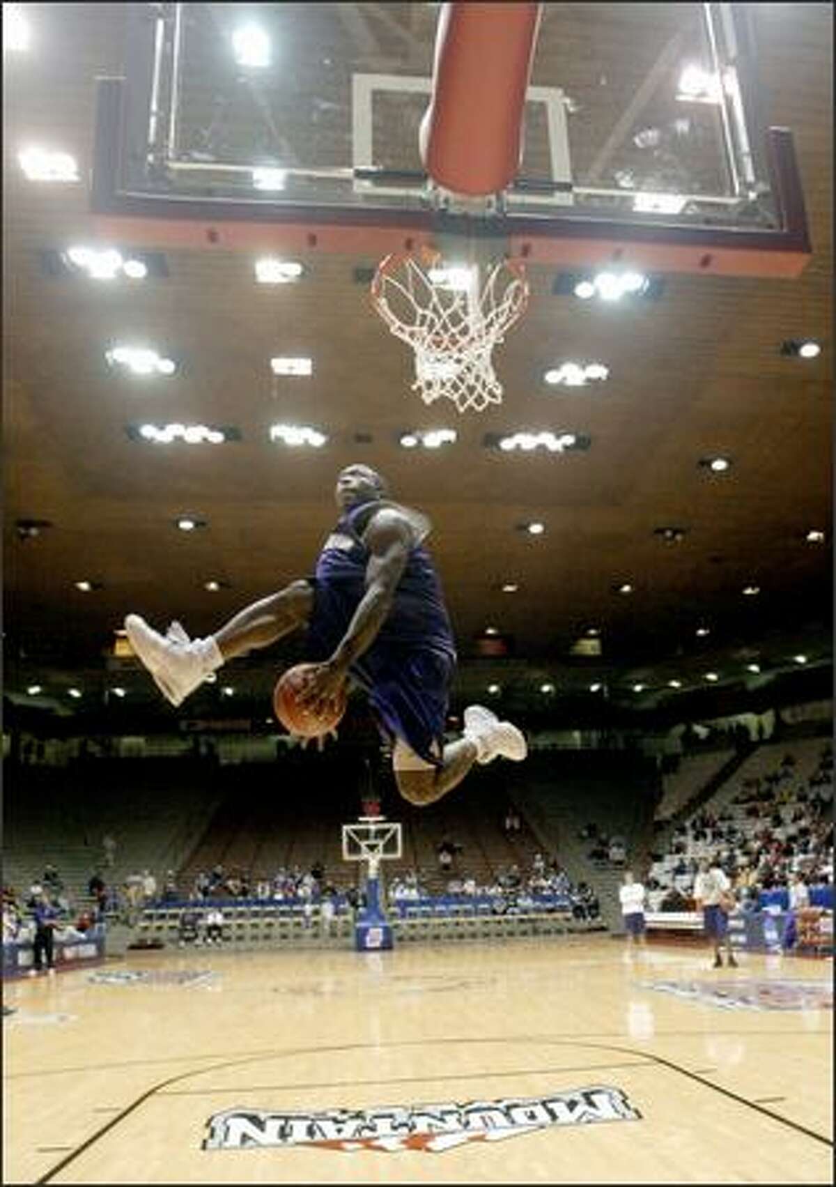 Nate Robinson works the ball through his legs before throwing down a dunk during a workout at The Pit, before the Huskies played -- and were defeated by -- Louisville in the NCAA playoffs.