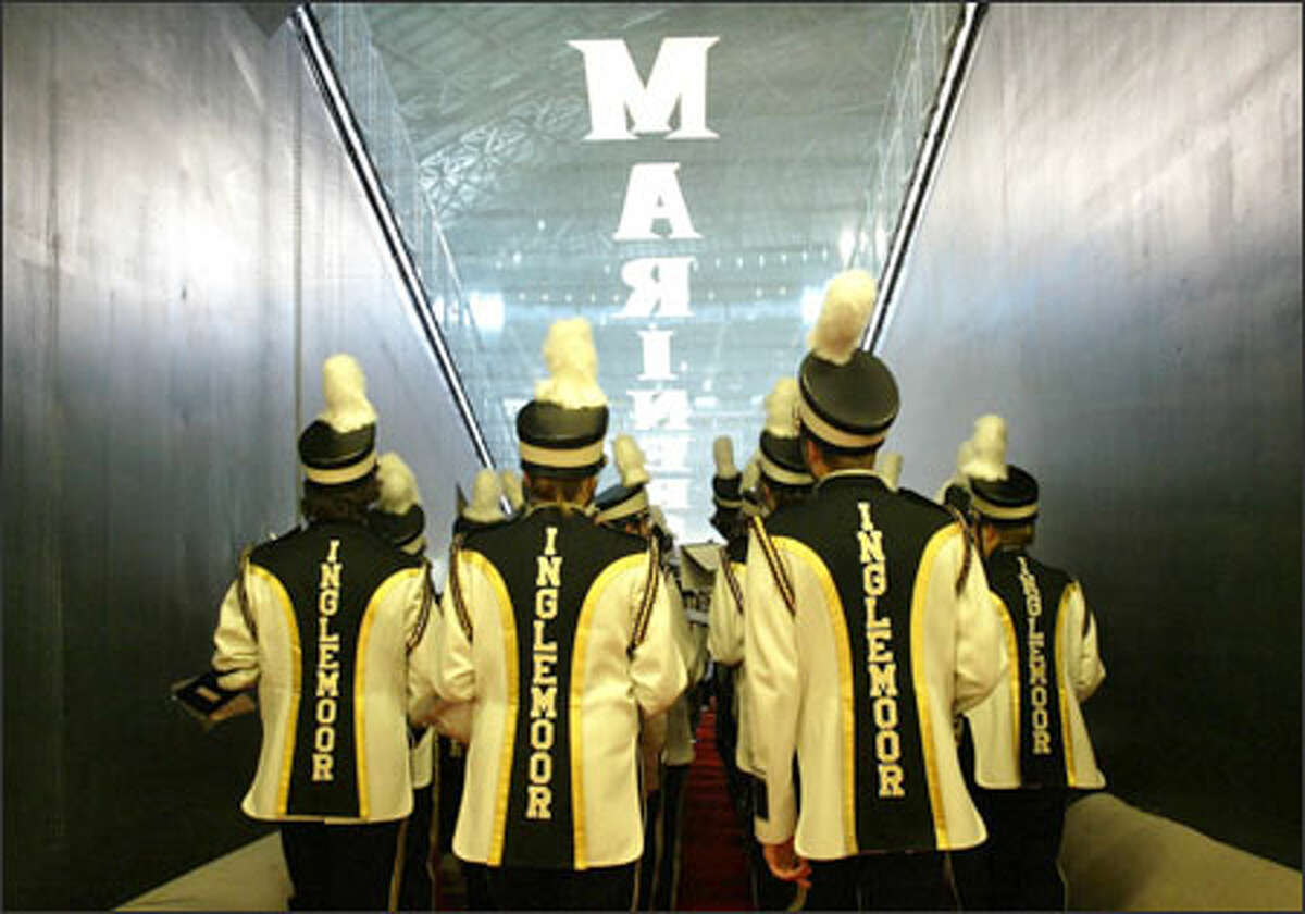 Members of the Inglemoor High School marching band prepare to strut their stuff on Safeco Field during Opening Day festivities for the Mariners' 2005 season.