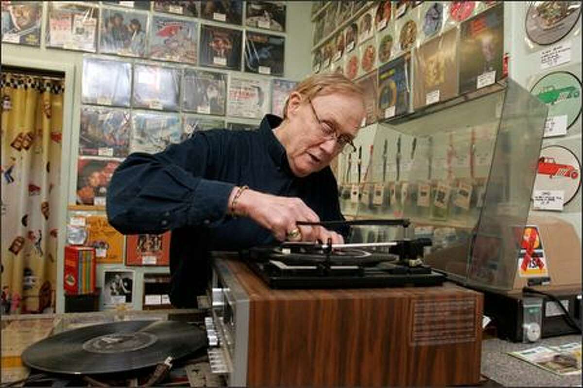 Jim Goff, owner of JNS Phonograph Needles, assesses the problem with a turntable brought in by a customer from Marysville.