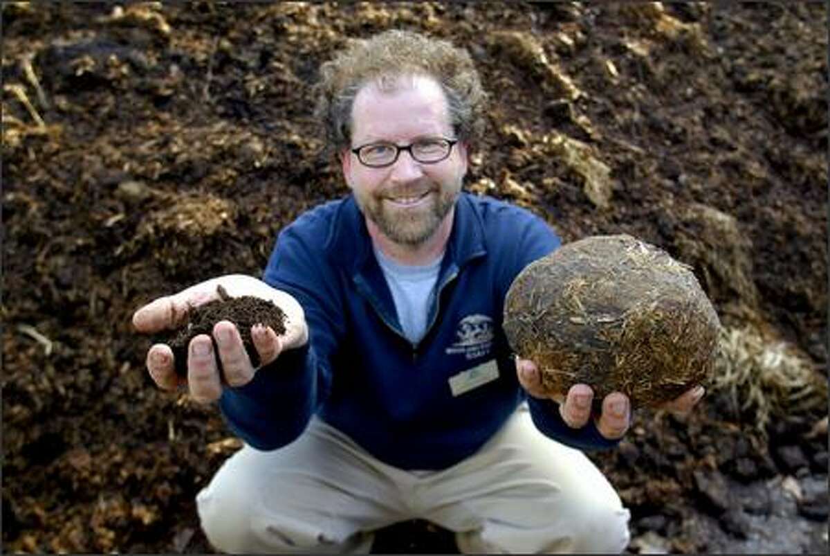 Dan Corum, Woodland Park Zoo's Dr. Doo, shows the beginning and end of the recycling process -- elephant poop on the right and compost on the left. The zoo sells compost carefully made from the doo, and it's coveted by gardeners.