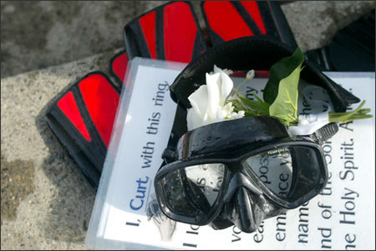 Scuba gear and plastic-encased cue cards that were used during the underwater ceremony.