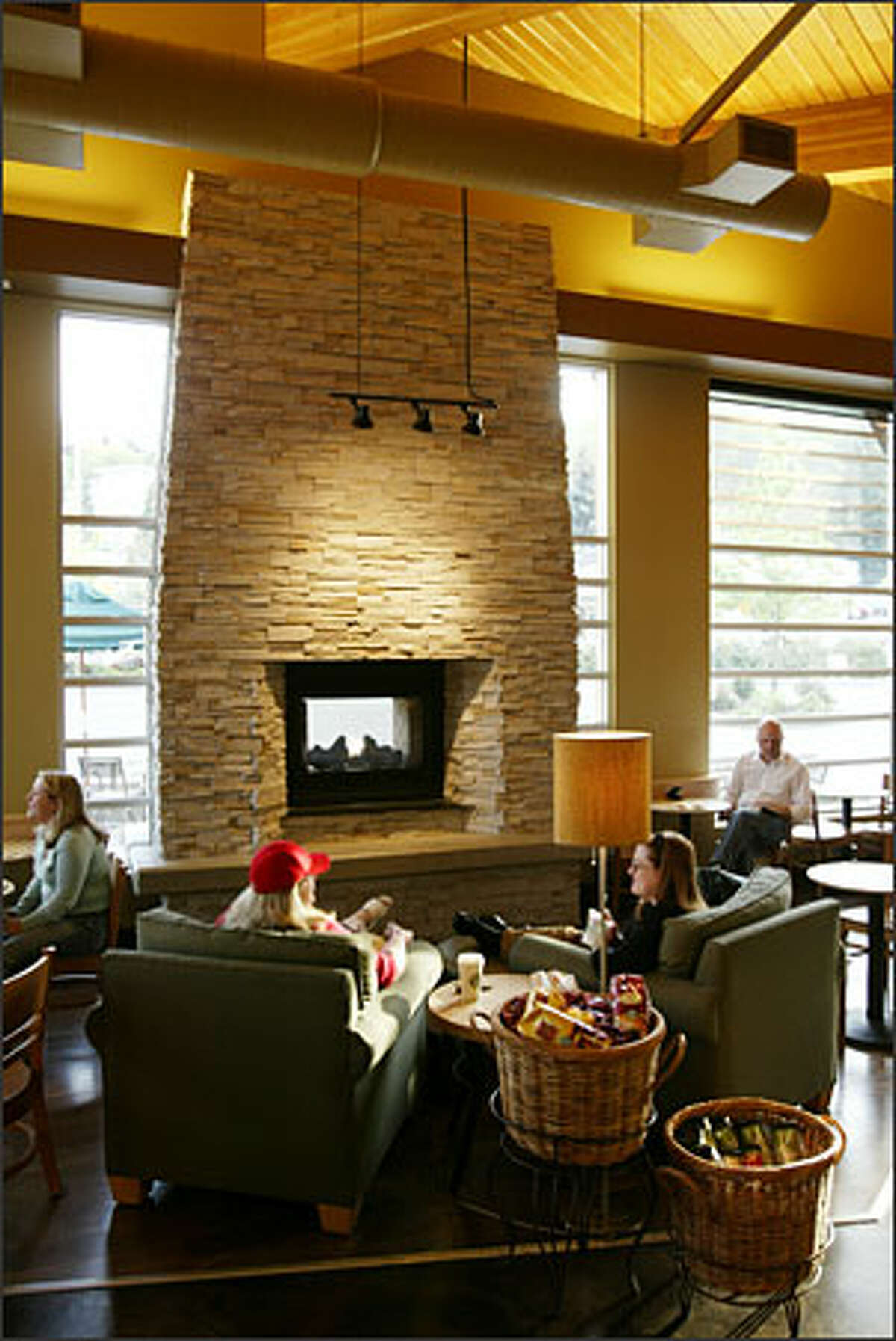 Starbucks put drama in its new Mercer Island store with an indoor/ outdoor gas fireplace.