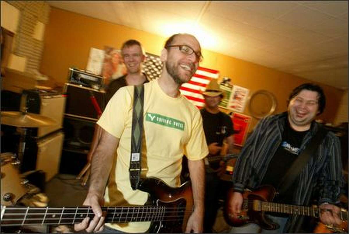 Bassist Rich Davidson, center, with the other members of the band Radio Nationals, plans to take an RV caravan to swing states to register new voters.