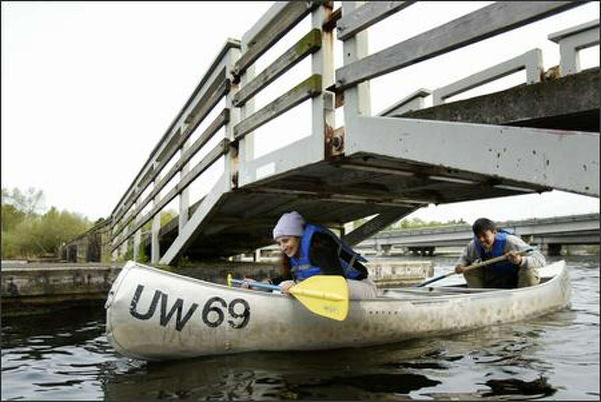 Feriyal Aslam and Wilmar Salim, from Los Angeles, pass under a footbridge connecting Marsh and Foster islands.