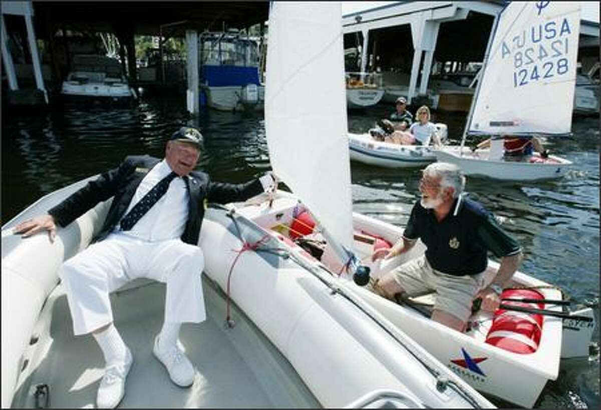 Jack Sullivan, left, Rear Commodore of the Seattle Yacht Club, tries to stop David Jennings, the Commodore of the Royal Vancouver Yacht Club from winning the annual Commode Cup Race during pre-opening day festivities on May 5, 2006 at the Seattle Yacht Club. Jennings won anyway in the race where cheating is encouraged.