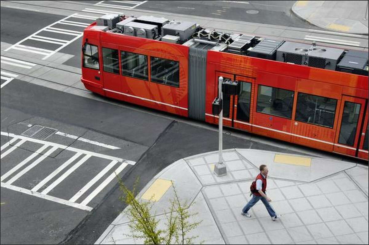 The Seattle Streetcar moves through the intersection of Ninth Avenue as it heads north on Westlake Avenue in South Lake Union.