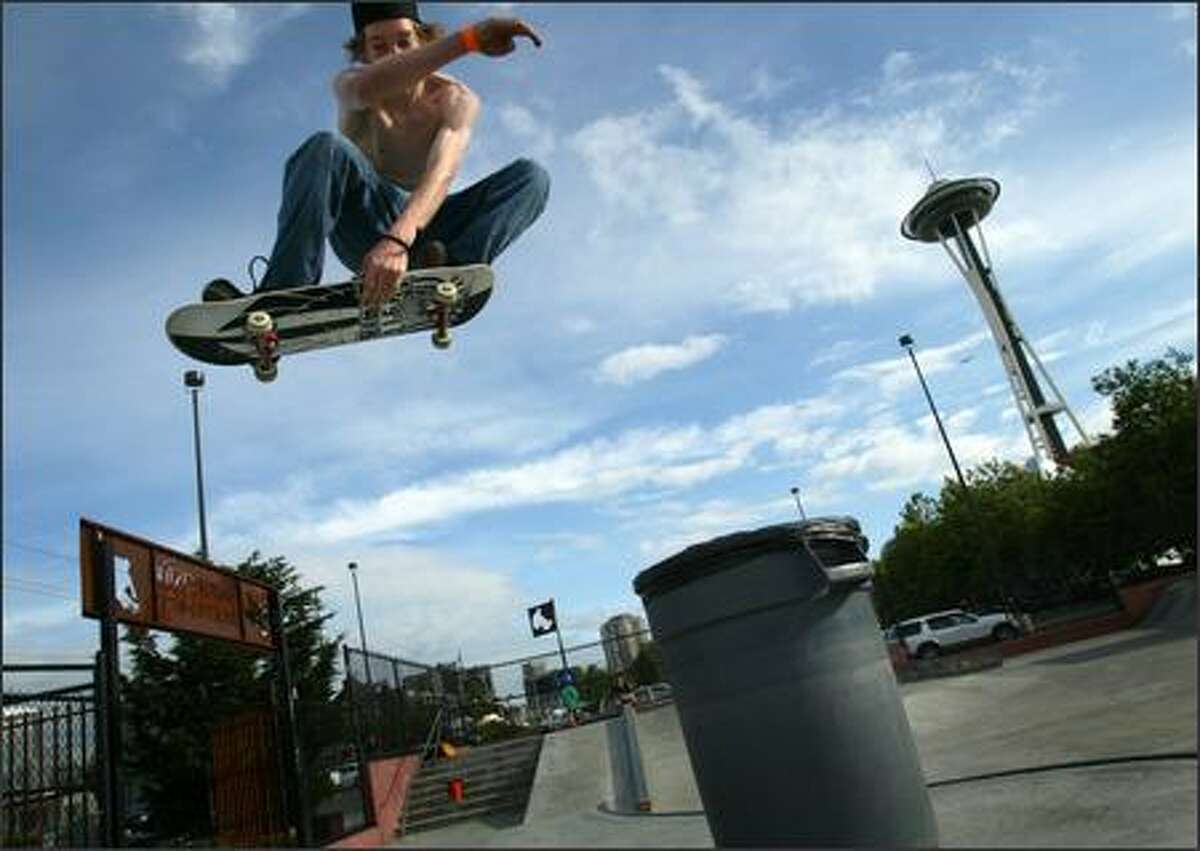 Jason Singler, 17, flies over a trash can Tuesday at the Seattle Center's skate park. The park is scheduled to be torn down, leaving the city with only one for skateboarders. A task force preparing a master plan on where to put new parks for the sport has asked for public opinion on the locations.