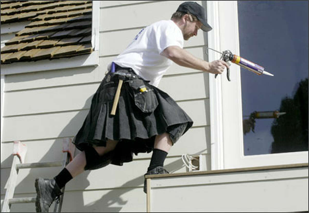 There's little in Lee Bryant's outfit to impede his stretch as he helps to remodel a home in the Blue Ridge neighborhood recently. Bryant, president of Halo Builders Group in North Seattle, is a kilt devotee and has been remodeling and building homes in kilts for more than a year, regardless of weather.