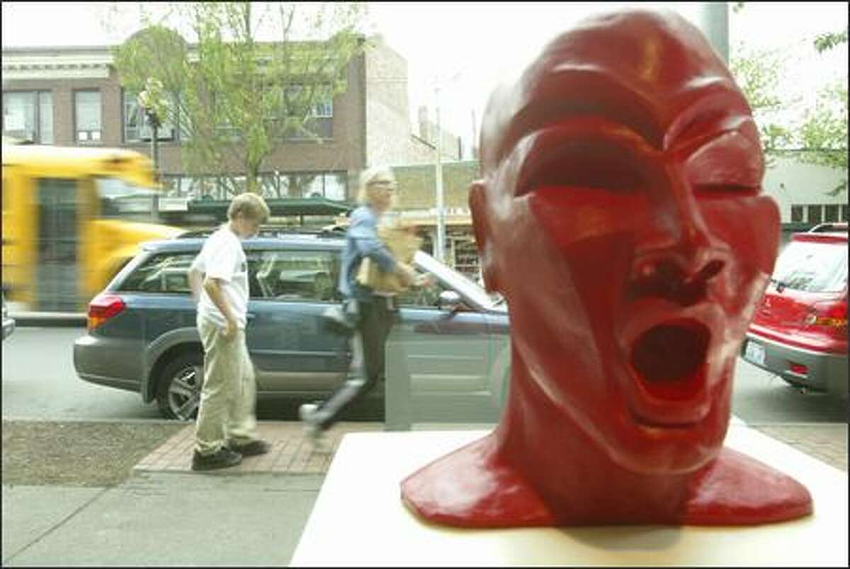 "Hot Head," a clay sculpture by Lezlie Jane of Seattle, is seen at the Columbia City Gallery. Columbia City is an example of how dramatically private investment and market forces can transform an area.
