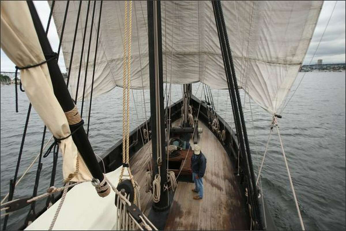 Captain Kyle Friauf stands on deck of La Nina, a hand-built replica of Columbus' ship, under sail on Lake Union. Built in 1992 to honor the 500th year anniversary of Columbus' voyage, it appeared in the film "1492" and has been touring the world ever since.