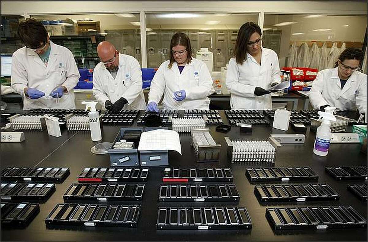 (l-r)Josh Lindgren, Andreas Alpisa, Krissy Brouner, Sheana Parry and Jody Parente work in the main production lab at the Allen Institute for Brain Science in Seattle.