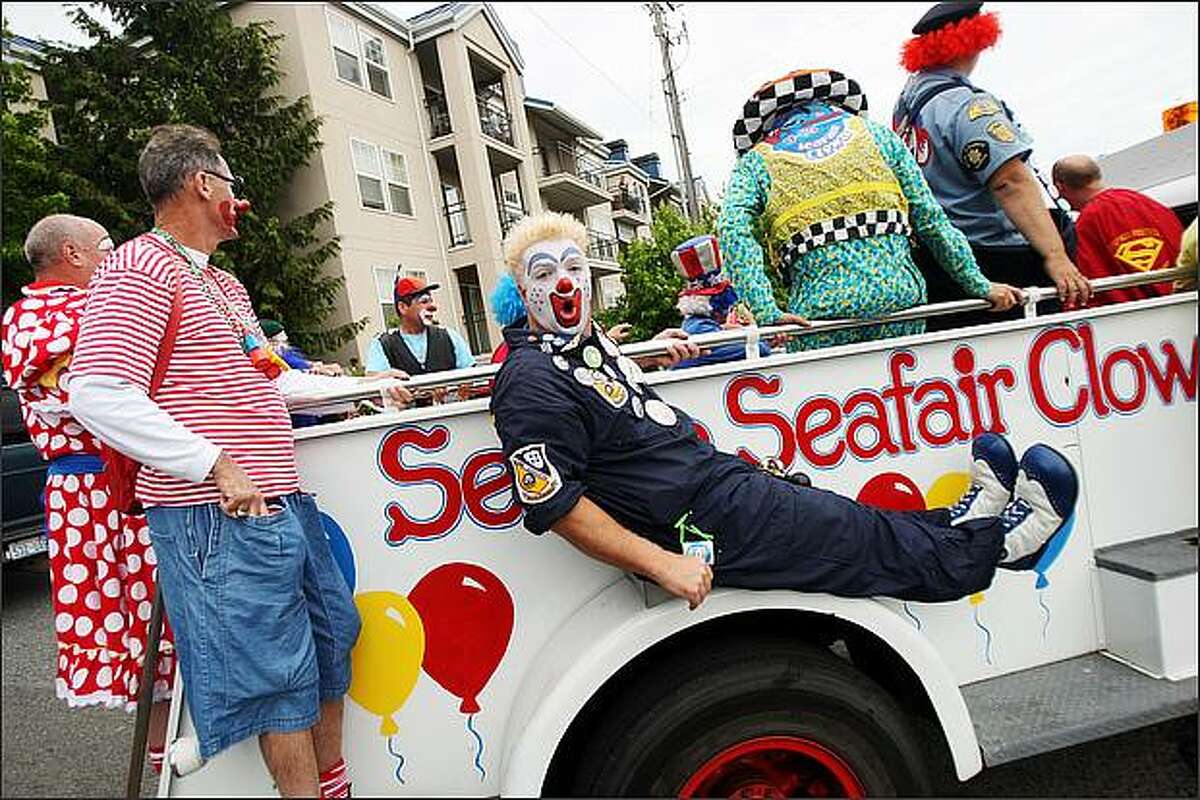 Jay "Woody" Wood, one of the Seattle Seafair Clowns, gets things rolling at the Greenwood Seafair Parade. (Staff Photo/Seattle Post-Intelligencer/Mike Kane)