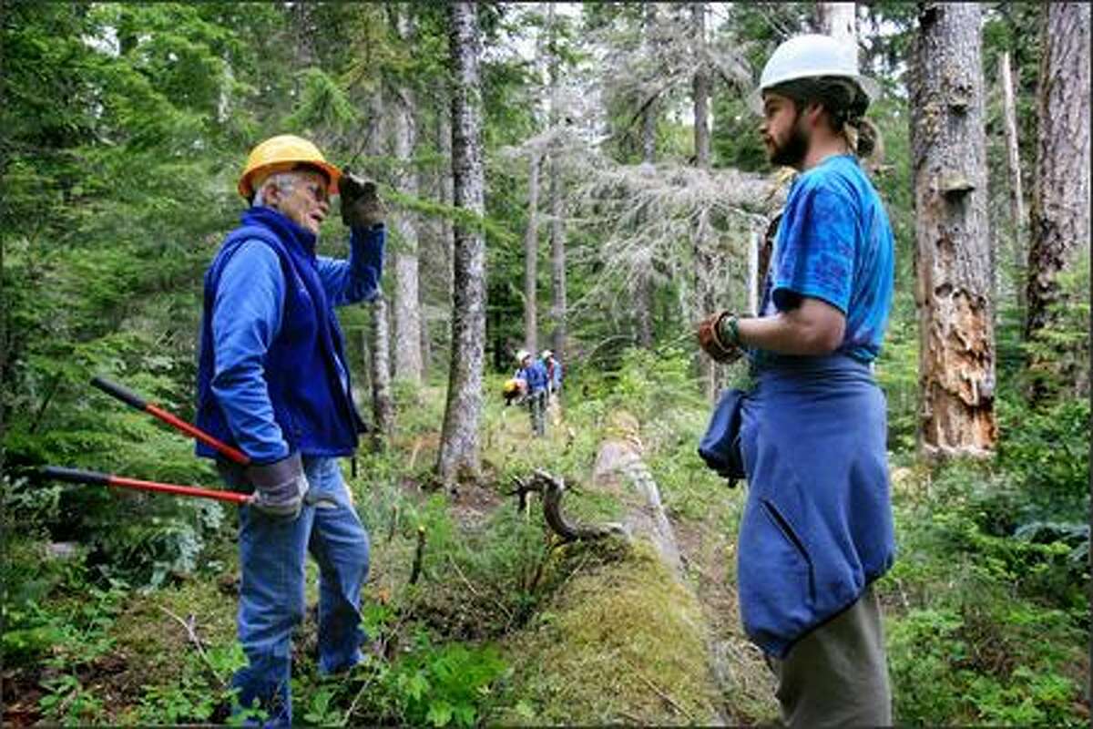 Elizabeth Putnam, 74, talks with a SCA corps member Sam Keller, 22, of Seattle while they worked on a trail in Mount Rainier National Park on Friday, June 22, 2007. Putnam, who founded the Student Conservation Association, has dedicated her professional life to the SCA since she was 22 years old.
