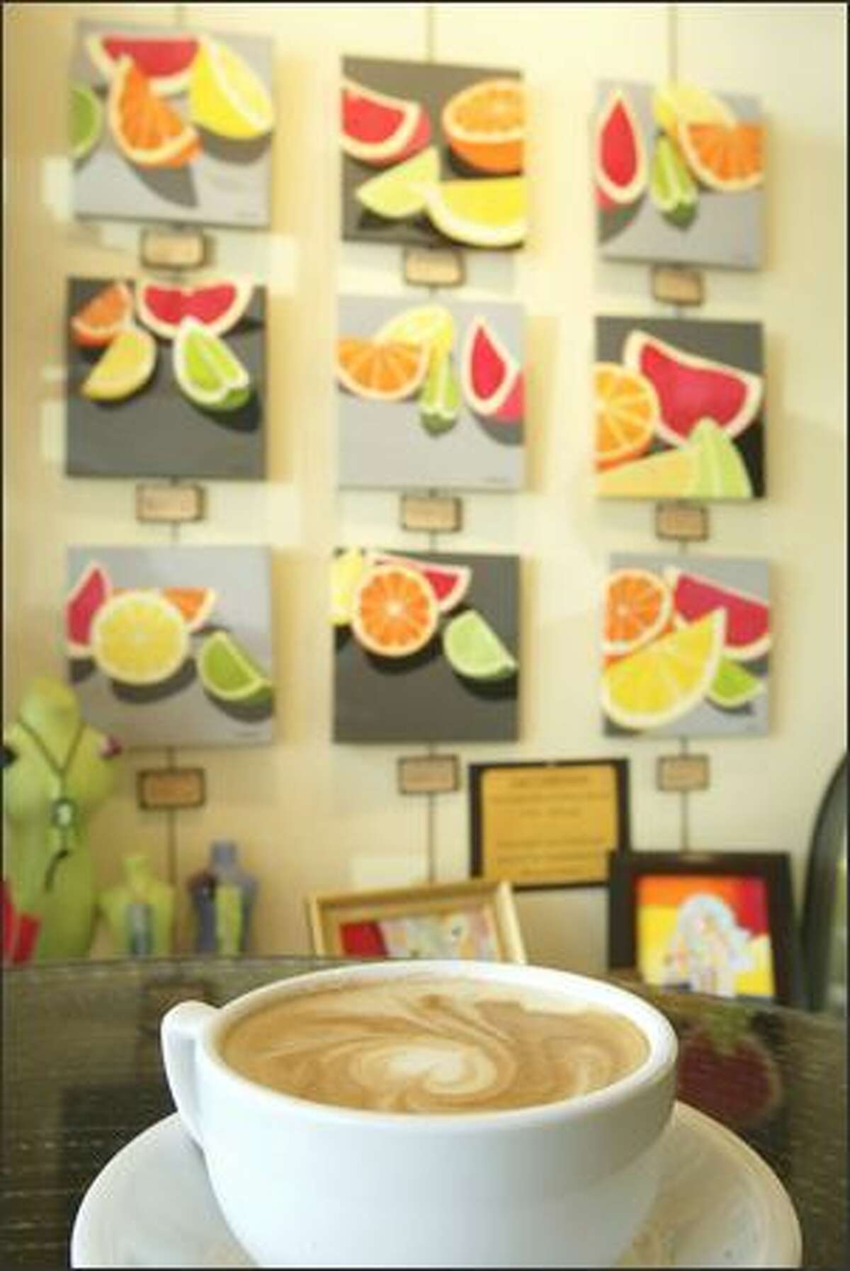Lynne Alexander's "Citrus Series" is among the fresh art perking up the scene at the Local Color coffeehouse at Pike Place Market.