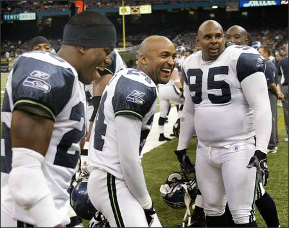 Seahawks' defenders, left to right, Ken Hamlin, Bobby Taylor and Rashad Moore had plenty to laugh and smile about as time wound down at the end of the game.