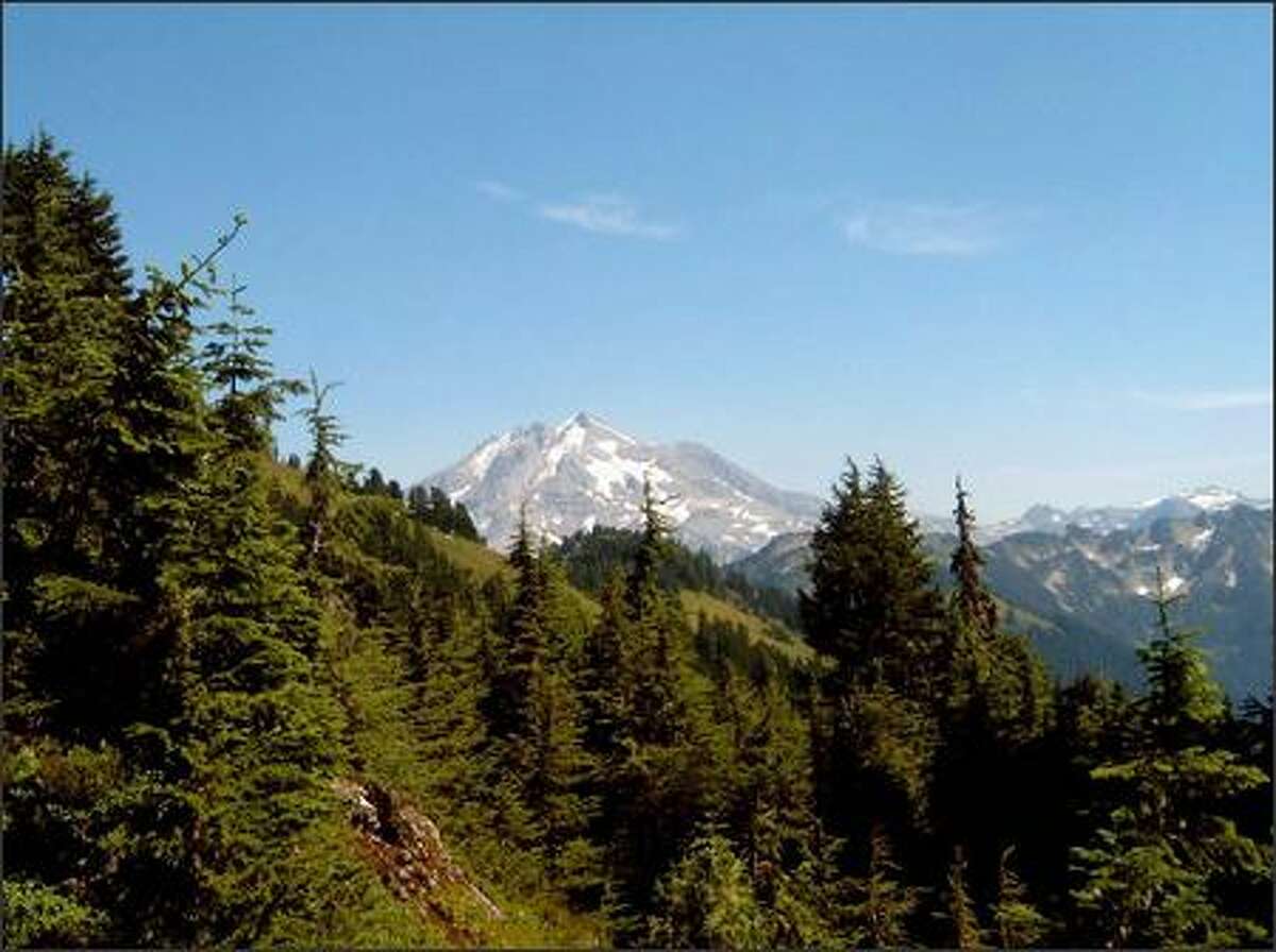 This view of Glacier Peak, a 10,520-foot volcano in the north-central Cascades, can be had after 5.5 miles and about 3,800 feet of elevation gain along the Lost Creek Ridge Trail.