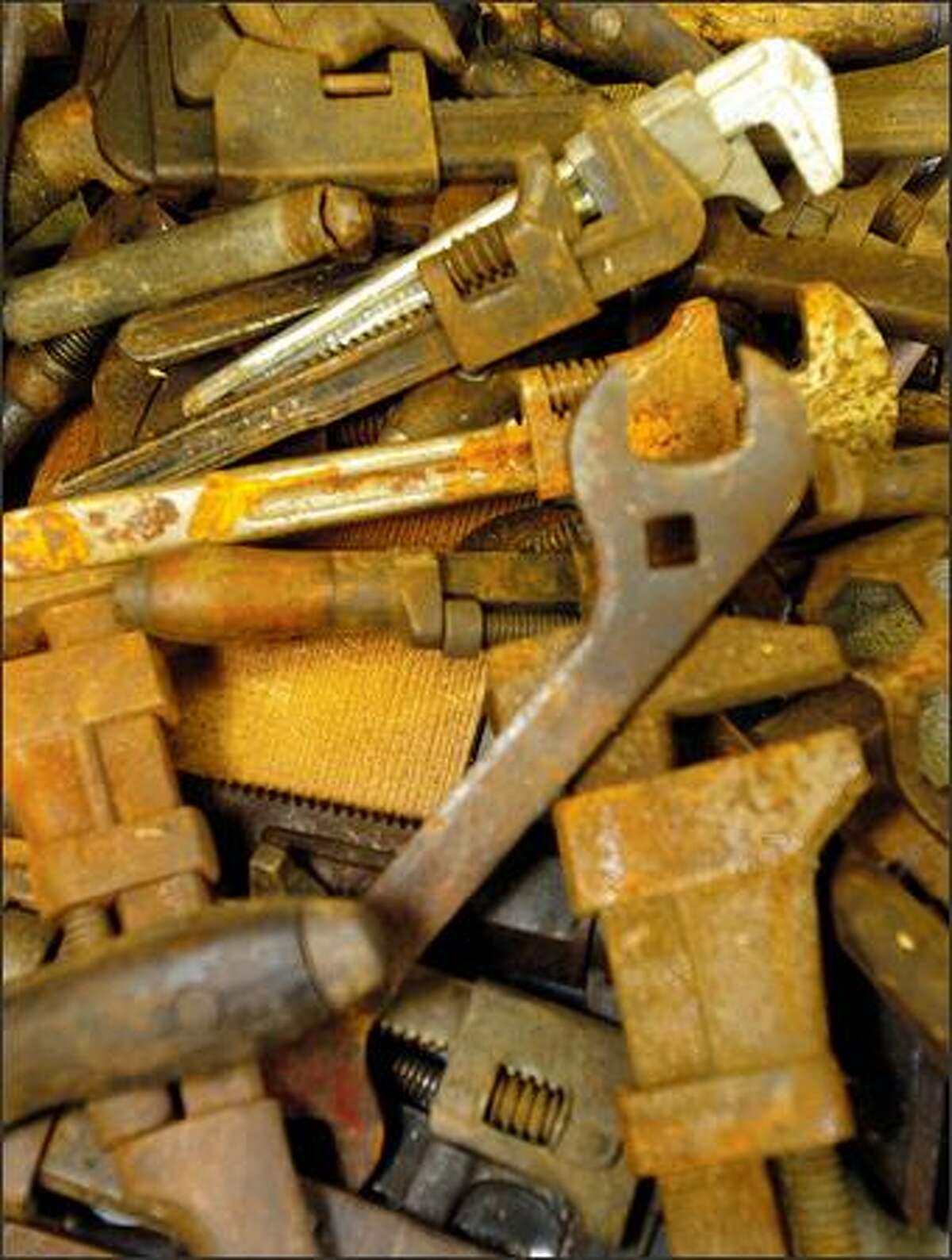 A pile of wrenches waits for wall space at the Western Heritage Center Interactive Museum at the Evergreen State Fairgrounds in Monroe.