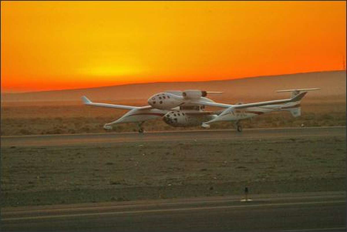 White Knight, piloted by Michael W. Melvill, and SpaceShipOne, piloted by Brian Binnie, take off just before the sun came up over the horizon.