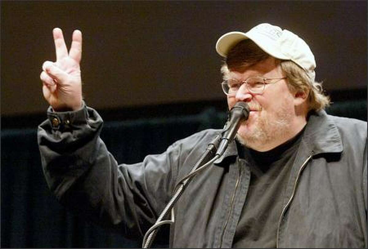 "Two more weeks," filmmaker Michael Moore tells a near full house at KeyArena last night. He drew a boisterous response -- and protesters.